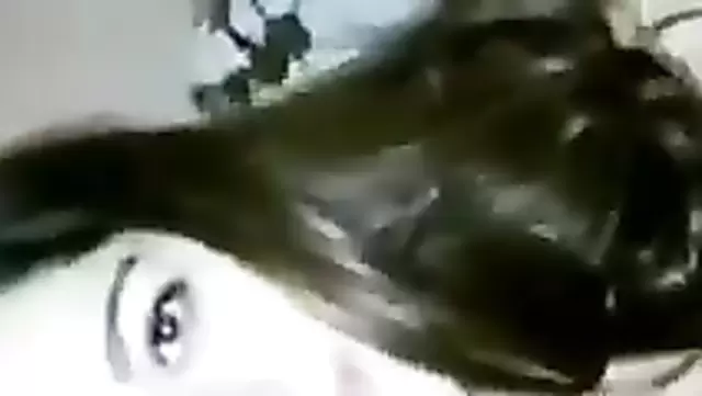 A beautiful Muslim girl gently caresses her new boyfriend's penis