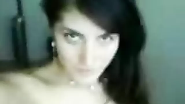 A naked Muslim woman shakes her breasts on camera